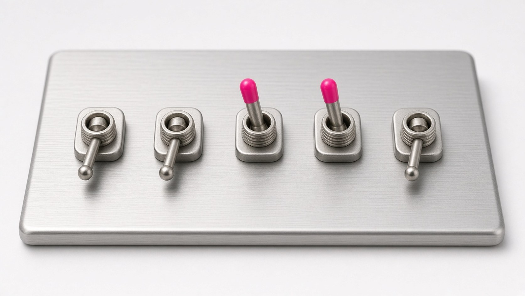 Five metal toggle switches on a panel, two flipped on with vivid pink tips